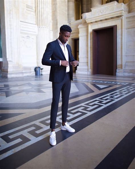 black suit with white shoes.